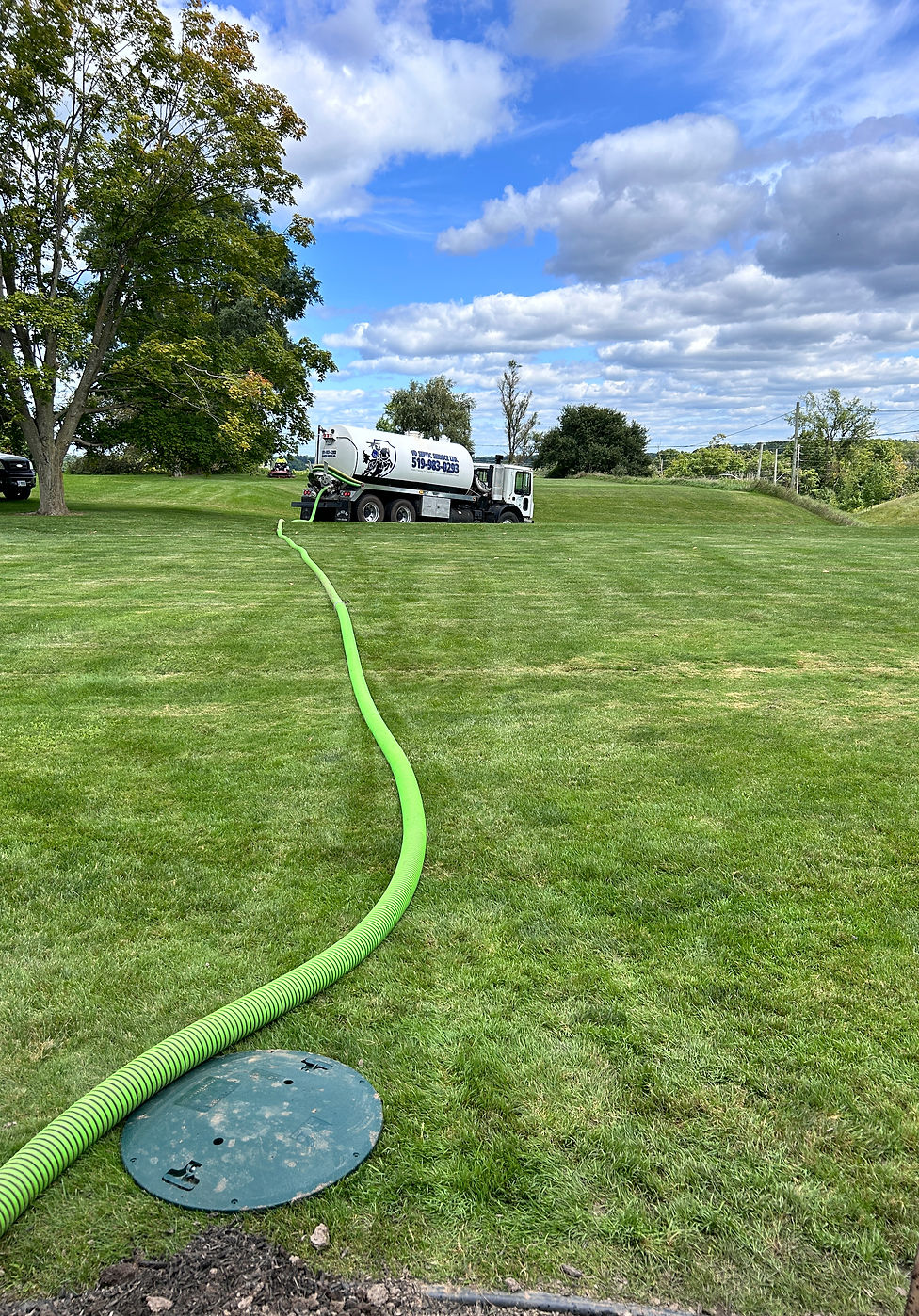VDN Septic Service Ltd truck pumping a septic tank